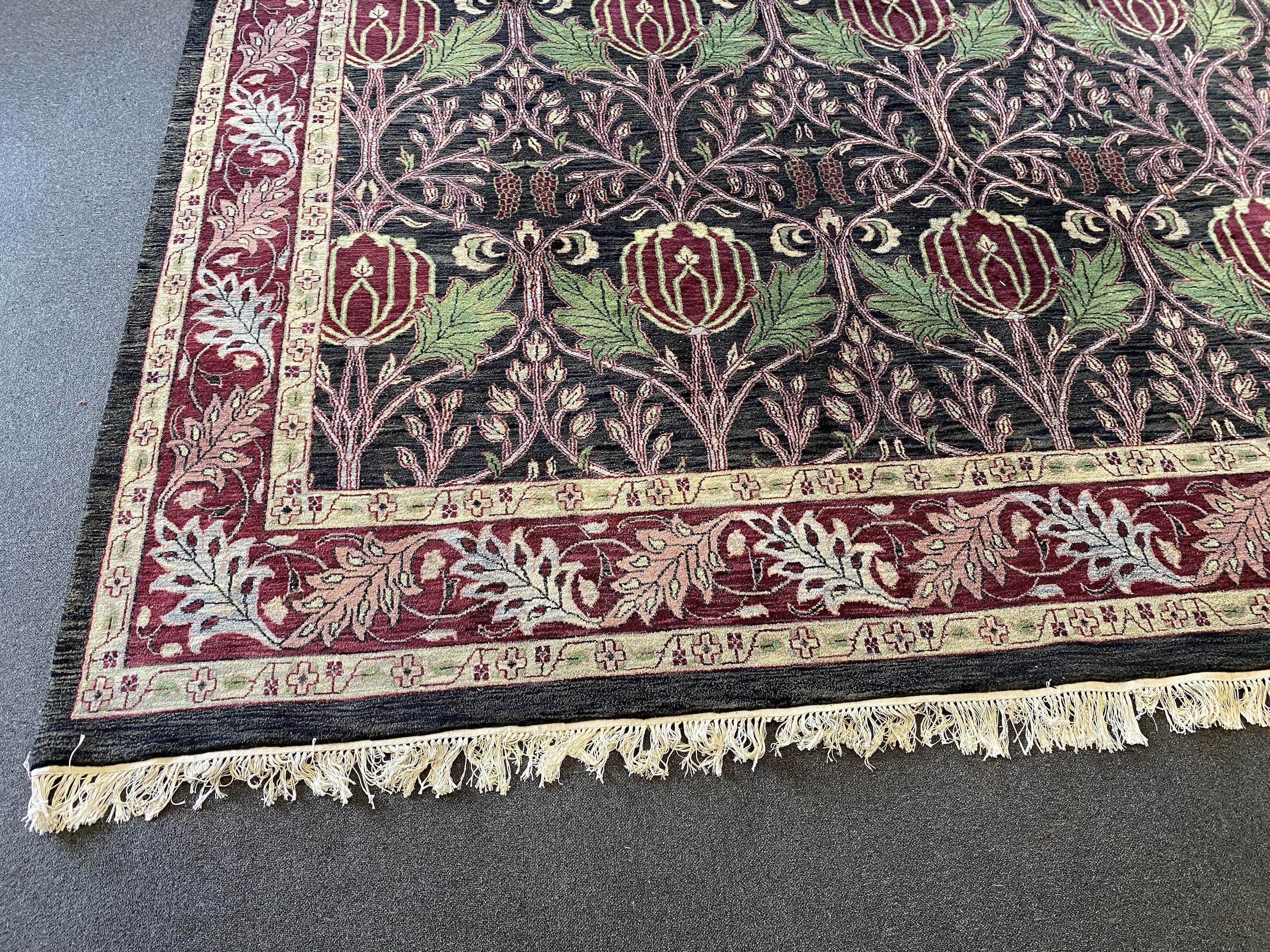 A large Indian Arts & Crafts style carpet, 541 x 358cm